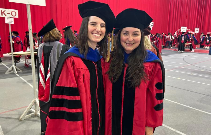 Claire Challancin and Jaimie Luria in Ph.D. regalia