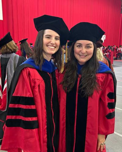 Claire Challancin and Jaimie Luria in Ph.D. regalia