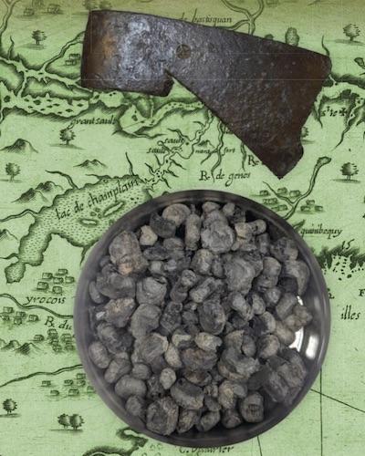 carbonized maize and iron axe